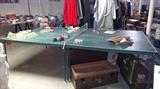 Ping Pong table with 2 steamer trunks, vintage clothes