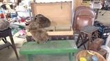 Large steamer trunk with Large animal collar and muff. Green wooden bench, folding chairs and fold out step stool