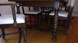 Dining room table and chairs have turned legs. China cabinet and table also have rod iron work.