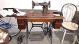 Singer #66 petal pump sewing machine in great condition. Has add on electric lamp