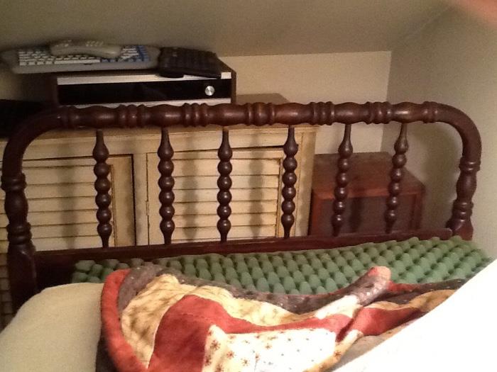 One of a pair of twin beds with foot -matching head and foot boards