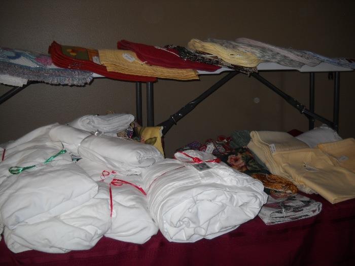 lots of linens, including sealy sheets.