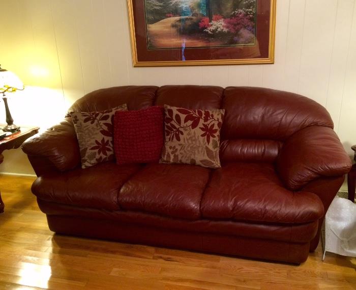 Great condition maroon-color leather couch - pillows for sale, too!