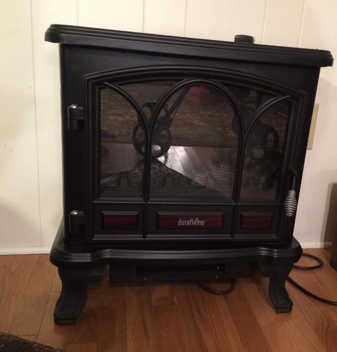 Duraflame faux fireplace with heat blower... Perfect warmth for a cold winter's night. And pretty, too! 