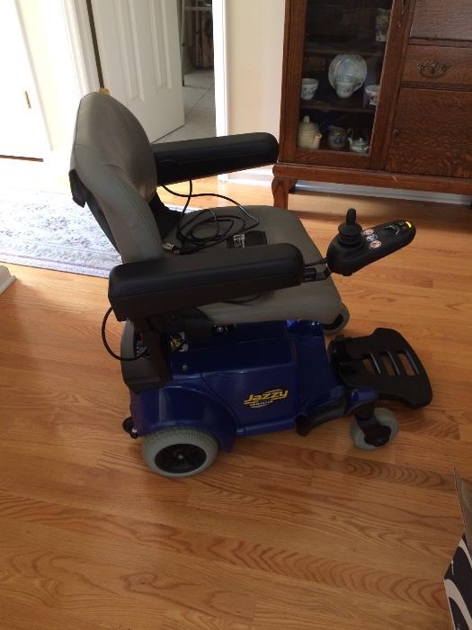 Blue Jazzy electric scooter in great condition.  Minimal signs of use.