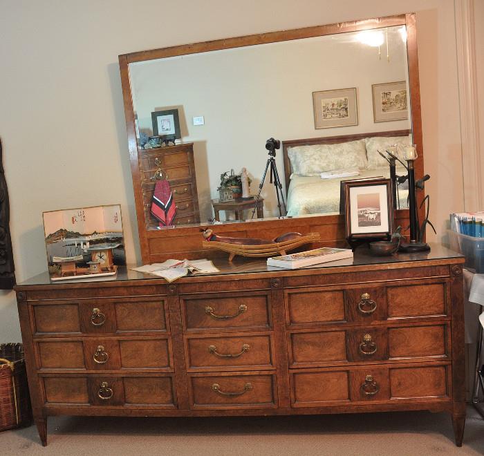Long, sleek Bassett dresser with large mirror - mirror attaches off center.  Top of both the dresser and chest have been protected with glass tops.
