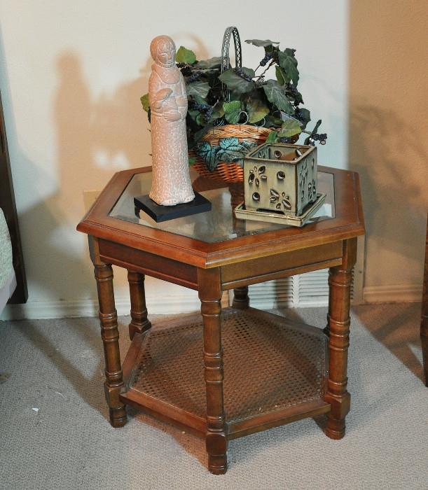 Occasional table with decorative accessories - used as a bedside table.
