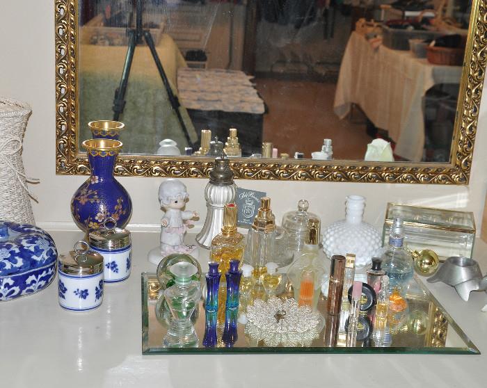 Dressing table with an assortment of miniature perfume bottles
