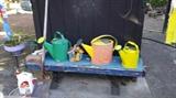 Lots and lots of colorful Watering Cans