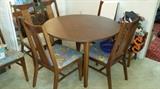 Mid-Century Modern/Danish Cane Back Chairs and Round Table with 3 Inserts for making it a 12 oblong Table. 6 Chairs-3 Leafs