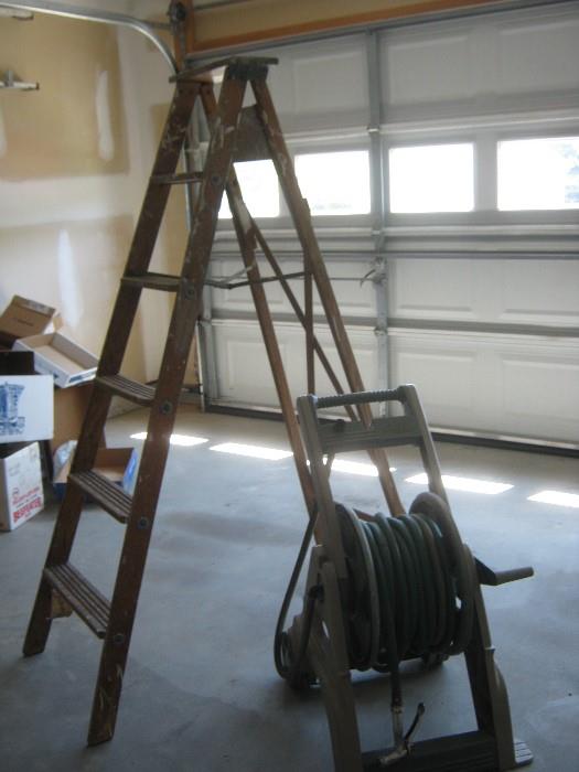 from our garden and hardware departments! a wooden ladder (also have an extension ladder) and garden hose take-up 