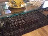 Glass and metal coffee table with gape leaf theme, vintage wool prayer rug