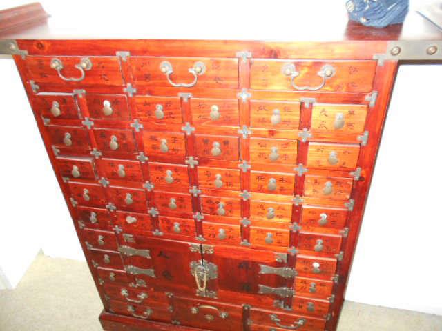 exciting oriental cabinet   Very detailed and each drawer opens and shuts correctly.  No defects and in excellent shape.......Brass is your trim  A REAL FIND $425.00   DUE TO THE AGE AND GOOD SHAPE THIS IS IN PRICE IS FIRM WITH NO CONCESSIONS.  A MASTER FIND AND A WONDERFUL STEAL AT THE PRICE!
