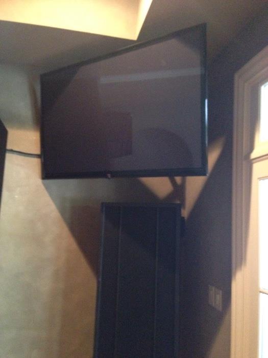 One of two 60" LG flat screen TVs