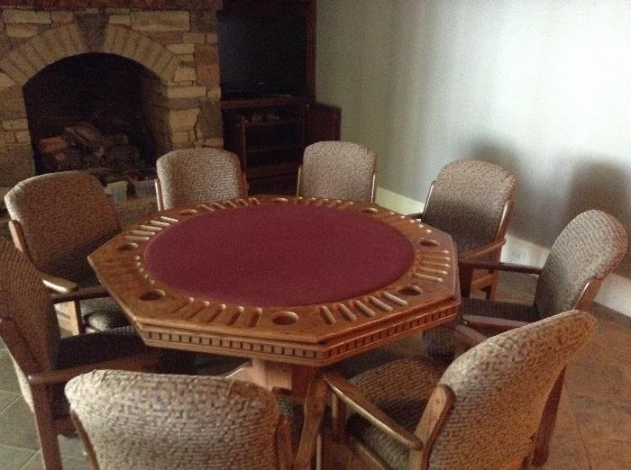 Game table with 8 chairs (top flips over to a solid surface)
