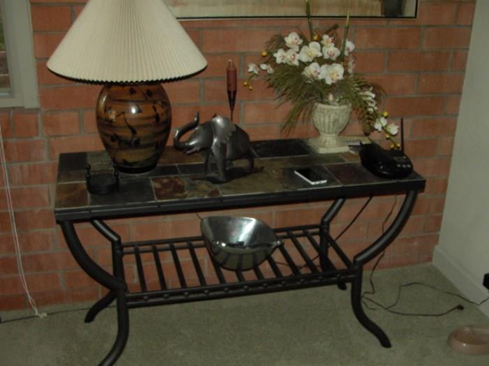 Wrought iron tile top table sofa