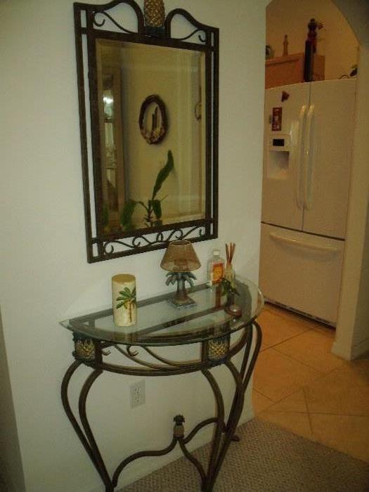 Metal and glass set for hall or entry way.  Mirror and table compose the set