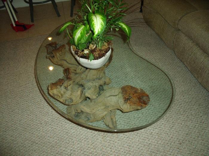 Unique coffee table.  Base is made from the root of a grape vine in Napa Valley.