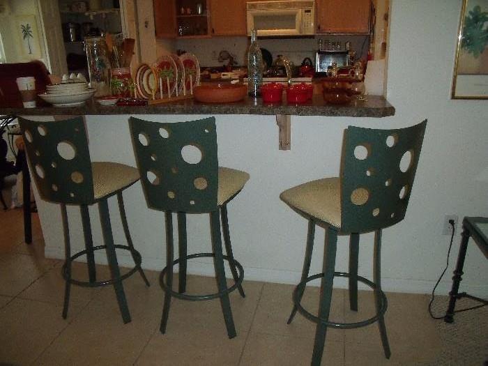 Set of 3 modern swivel bar stools.  Metal backs and padded seats