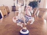 Lladro Girl on Carousel retired 2001, selling on ebay from $795-1800. $500. In excellent condition. 