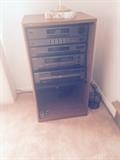 Stereo equipment and cabinet, sold as a set $150.