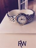 Women's Raymond Weil two tone watch in excellent condition.  Battery powered, works.  In original box with warranty.  Paid $795, selling for $200.