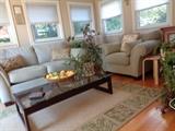 Love seat over size chair, area rug and coffee table