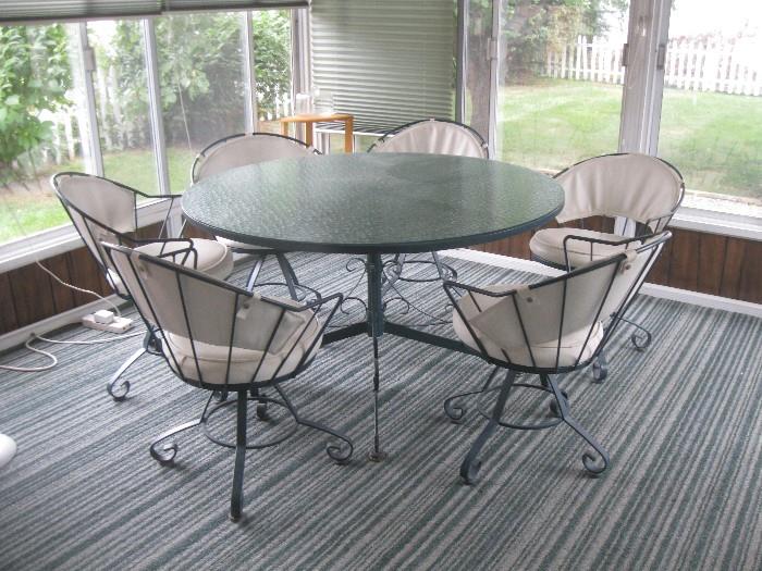 Wrought iron, glass top patio set with 6 chairs - $125