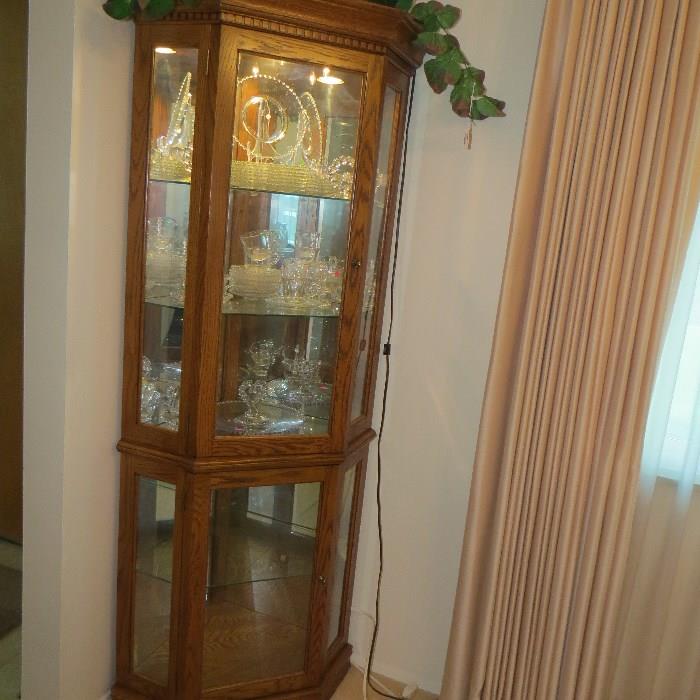 Oak lighted curio cabinet