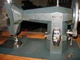 Kenmore sewing machine in wood cabinet in excellent condition.