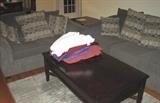 Living couch and loveseat, with coffee table & linens