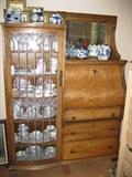 nice old china cabinet/desk with Delft Blue ceramics.
