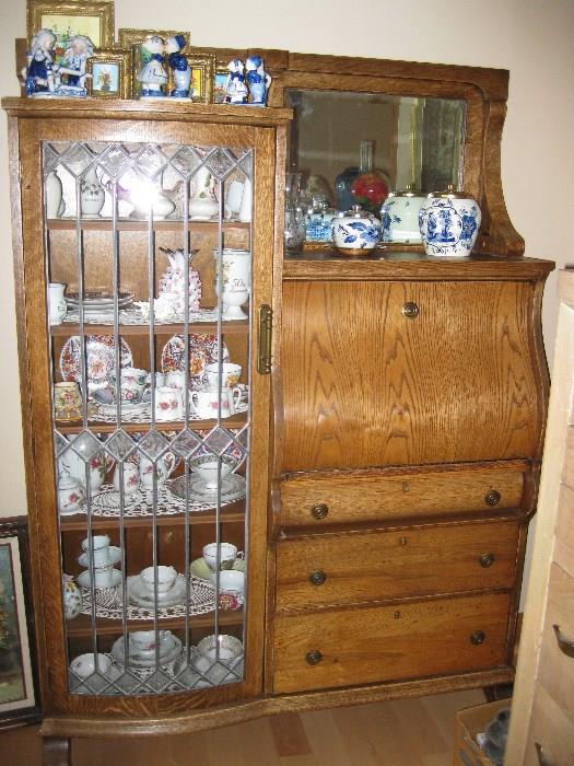 nice old china cabinet/desk with Delft Blue ceramics.