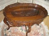 oval table with eagle under glass.