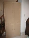 wood cupboard, glass doors (painted over)