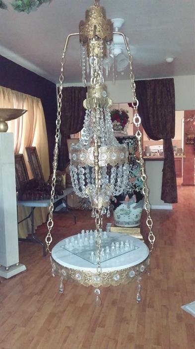 A swag chandelier with the original marble base , 4 feet long 2 feet wide in excellent condition.

Any person who loves collecting unique items this would be the one,  You could actually look it up on the internet and it does retail for about $1,200 ,but guess what you can have it for only

475.00