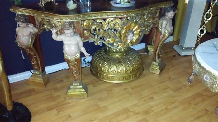 let me ask you this have , Have you ever seen a piece like this, 6 feet long 4 feet wide. A beautiful gilded hand carved cherub table, This is a reproduction but again have you ever seen one like this, this piece is in great condition except for the fact one finger broke off during the movement but can easily be replaced

I bought this piece for $3,200 but guess what it is yours for only

900.00