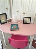 egg-shaped table, hot pink chair and great light and art for kids