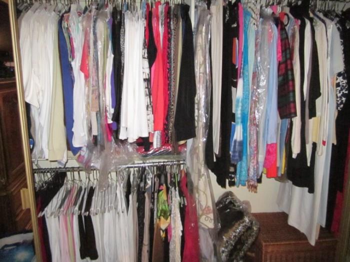 One of several closets full of better women's clothing. Also several boxes full of better clothing.