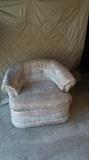 2 Swivel chairs in mauve colored pattern