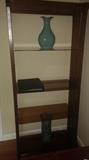 Smoked lass and wood based bookcase. 5' 1/2 feet tall x 30 ", depth 14" deep