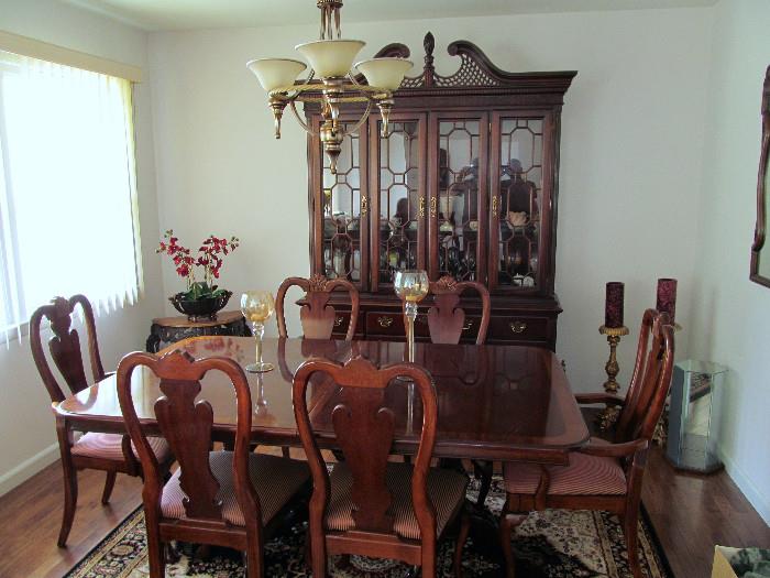 MAHOGANY, DOUBLE PEDESTAL DINNING TABLE WITH 4 SIDE AND 2 ARM UPHOLSTERED CHAIRS, ASIAN AREA RUG AND 4 DOOR CHINA CABINET   