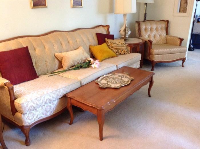 Matching vintage sofa, chair, and footstool