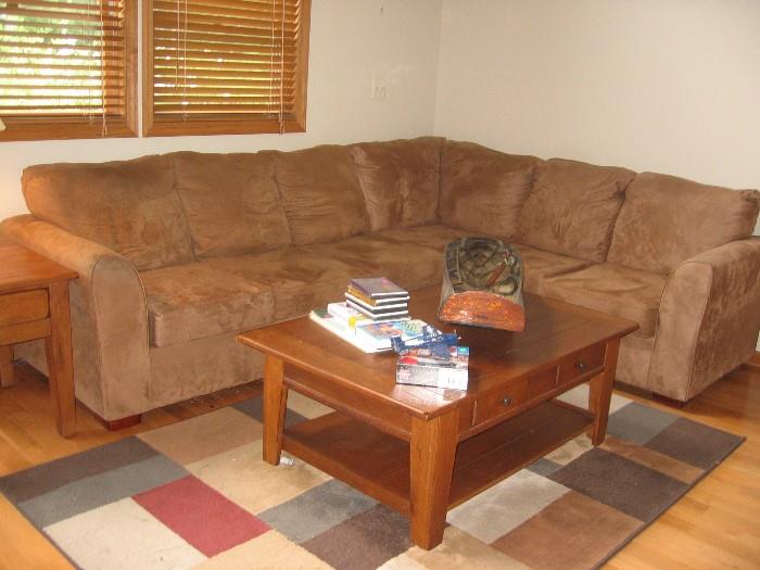 tan micro fiber sectional, great condition with Broyhill coffee table, rug