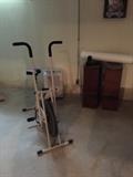 Stationary bike - side table bookcases, dehumidifer
