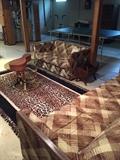 Vintage couch, love seat, leopard print rug, brass and glass round table, and more!
