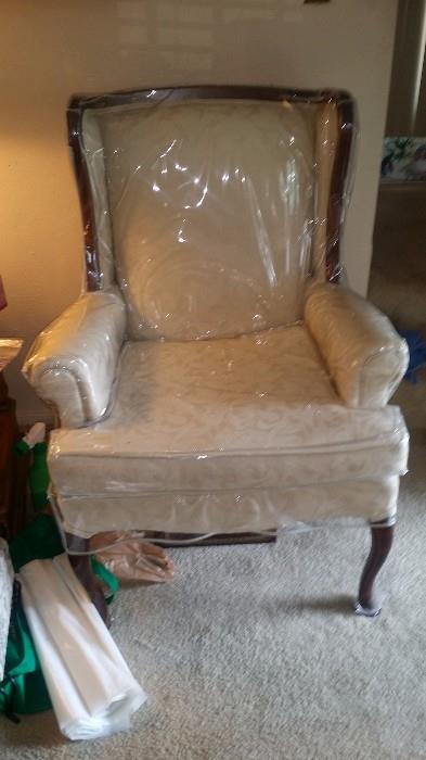 One of a pair of wing back chairs