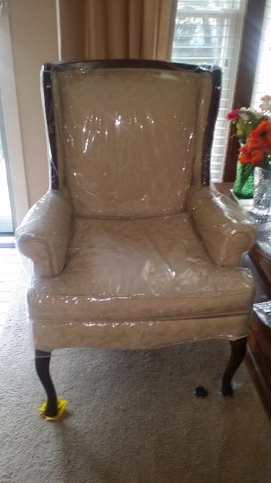 One of a pair of wing back chairs.
