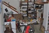 Just one small section of a 1,200 square foot garage! Several ladders, Craftsman 10" table saw, tile, paint, paint supplies, woodworking tools, automotive items, wrenches, Stanley planes, helmets, wood, bicycle, lawnmowers, apple press... the list keeps going and going!