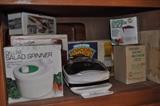 Kitchen items including salad spinner, scale, percolator, popcorn popper, electric knife and more.